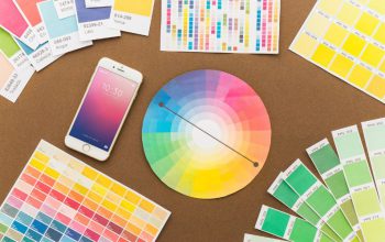 Color swatches and smartphone on table.